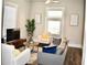 Spacious living room with comfy seating and large TV at 531 Connally St, Atlanta, GA 30312