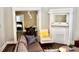 Living room with gray sofa, yellow armchair, and fireplace at 531 Connally St, Atlanta, GA 30312