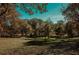 Scenic park with a grassy area, and colorful autumn trees at 531 Connally St, Atlanta, GA 30312