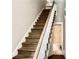 Wooden staircase leading to upper level with bathroom view at 531 Connally St, Atlanta, GA 30312