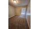 Spacious bedroom with neutral wall paint and carpeted floor at 5769 Shadow Creek Dr, Lithonia, GA 30058