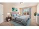 Bedroom with a bed, nightstands, and window at 4361 River Vista Rd, Ellenwood, GA 30294