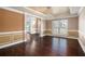 Formal dining room featuring hardwood floors and wainscoting at 4361 River Vista Rd, Ellenwood, GA 30294