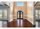 Two-story foyer with hardwood floors and elegant door at 4361 River Vista Rd, Ellenwood, GA 30294