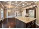 Island kitchen with granite countertops and hardwood floors at 4361 River Vista Rd, Ellenwood, GA 30294