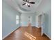 Bright and airy bedroom with hardwood floors and ceiling fan at 615 Brookwater Dr, Stockbridge, GA 30281