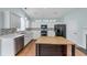 Updated kitchen, featuring white cabinets and mosaic backsplash at 615 Brookwater Dr, Stockbridge, GA 30281