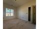 Empty bedroom with window and doorway at 85 Presley Farm Pkwy, Rockmart, GA 30153