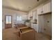 Spacious kitchen with center island, white cabinets, and natural light; perfect for culinary enthusiasts at 85 Presley Farm Pkwy, Rockmart, GA 30153