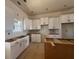 Modern kitchen with white cabinets, sleek hardware, and ample counter space awaits your personal touch at 85 Presley Farm Pkwy, Rockmart, GA 30153