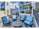 Relaxing back patio with seating area and tranquil neighborhood view at 3959 Saint Elisabeth Sq, Duluth, GA 30096
