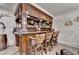 Elegant basement bar with granite countertop and custom cabinetry at 3959 Saint Elisabeth Sq, Duluth, GA 30096