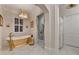 Elegant bathroom with gold bathtub, marble shower, and separate vanity at 3959 Saint Elisabeth Sq, Duluth, GA 30096