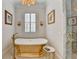 Spa-like bathroom with gold free-standing tub and marble shower at 3959 Saint Elisabeth Sq, Duluth, GA 30096