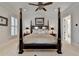 Elegant Primary bedroom with a large four poster bed at 3959 Saint Elisabeth Sq, Duluth, GA 30096