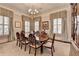 Elegant formal dining room featuring a large table and hardwood floors at 3959 Saint Elisabeth Sq, Duluth, GA 30096