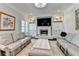 Spacious Gathering room with comfortable seating, built-in shelving, and a fireplace at 3959 Saint Elisabeth Sq, Duluth, GA 30096