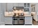 Modern kitchen with professional-grade range and granite countertops at 3959 Saint Elisabeth Sq, Duluth, GA 30096