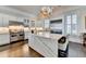 Gourmet kitchen with large marble island and high-end appliances at 3959 Saint Elisabeth Sq, Duluth, GA 30096