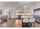 Gourmet kitchen features a large island, stainless steel appliances, and white cabinetry at 3959 Saint Elisabeth Sq, Duluth, GA 30096