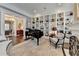 Charming music room with a grand piano and built-in shelving at 3959 Saint Elisabeth Sq, Duluth, GA 30096