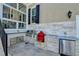 Outdoor kitchen with grill, refrigerator, and stone counters at 3959 Saint Elisabeth Sq, Duluth, GA 30096