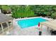 Community pool with lounge chairs and a pergola at 3959 Saint Elisabeth Sq, Duluth, GA 30096