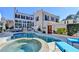 Inviting pool and hot tub with a spacious patio and outdoor seating at 3959 Saint Elisabeth Sq, Duluth, GA 30096