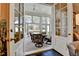 Relaxing sunroom features ample natural light and comfortable furnishings at 3959 Saint Elisabeth Sq, Duluth, GA 30096