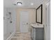 Renovated bathroom features walk-in shower with subway tile, updated vanity, and new flooring at 1256 Elizabeth Ave, Atlanta, GA 30310