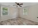 Bright bedroom features hardwood floors, neutral walls, and natural light from two windows at 1256 Elizabeth Ave, Atlanta, GA 30310