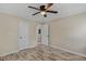 Neutral bedroom with two closets, a ceiling fan, and stylish flooring for easy maintenance at 1256 Elizabeth Ave, Atlanta, GA 30310