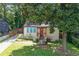 Charming single-story home with a manicured front lawn and a vibrant orange front door at 1256 Elizabeth Ave, Atlanta, GA 30310