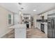 Modern kitchen featuring white cabinets, a stainless steel refrigerator, and an island at 1256 Elizabeth Ave, Atlanta, GA 30310