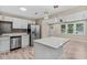 Modern kitchen featuring stainless steel appliances, quartz countertops, and stylish gray backsplash at 1256 Elizabeth Ave, Atlanta, GA 30310