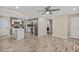 Open-concept living area leading to a modern kitchen with stainless steel appliances at 1256 Elizabeth Ave, Atlanta, GA 30310