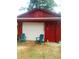 Red garage with white door and two teal chairs at 1577 Dellwood Circle, Morrow, GA 30260