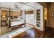 Spacious bedroom with a four-poster bed and built-in shelving at 2583 Habersham Nw Rd, Atlanta, GA 30305