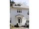 White two-story house with a classic design, gray roof, and manicured landscaping at 2583 Habersham Nw Rd, Atlanta, GA 30305