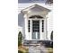 Elegant front entry with a light blue door, white columns, and brick steps at 2583 Habersham Nw Rd, Atlanta, GA 30305