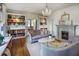 Elegant living room with built-in bookshelves, hardwood floors, and a fireplace at 2583 Habersham Nw Rd, Atlanta, GA 30305