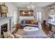 Living room with a fireplace, built-in shelves, and hardwood floors at 2583 Habersham Nw Rd, Atlanta, GA 30305