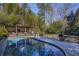 Inviting kidney-shaped pool with pergola and spacious deck at 2583 Habersham Nw Rd, Atlanta, GA 30305