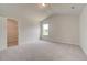 Well-lit bedroom featuring a window, closet, and carpet at 508 Dolce Rd, Locust Grove, GA 30248