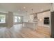 Modern kitchen with white cabinets, island, and stainless steel appliances at 508 Dolce Rd, Locust Grove, GA 30248