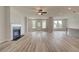 Spacious living room with hardwood floors, fireplace, and access to kitchen at 508 Dolce Rd, Locust Grove, GA 30248