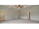 Large main bedroom with carpet, ceiling fan, and bathroom access at 508 Dolce Rd, Locust Grove, GA 30248