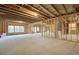 Unfinished basement with framed walls and exposed beams at 508 Dolce Rd, Locust Grove, GA 30248