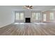 Gathering room with hardwood floors, fireplace and access to backyard at 203 Arabella Pkwy, Locust Grove, GA 30248