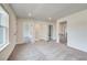 Hallway with natural light, providing access to bedrooms and closet space at 203 Arabella Pkwy, Locust Grove, GA 30248